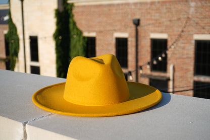 Bright yelow wide brim unisex fedora hat.