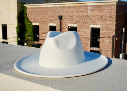 A white color wide brim fedora.